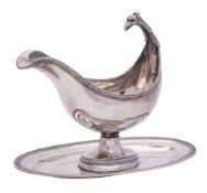 A 19th Century French silver pedestal sauce boat, worn stamped marks: of boat-shaped outline,