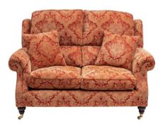 An upholstered two seat sofa by Parker Knoll, modern,: with outscrolled arms,