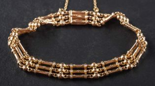 A bar chain link bracelet with ball spacers,: stamped '15', length ca. 20.5cm, total weight ca. 18.