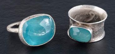 Two silver, gemset rings,: one set with a cabochon-cut aquamarine, with maker's mark 'Pe',