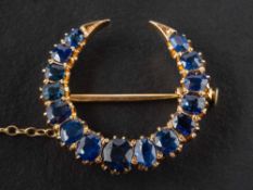 A Victorian, gold, mixed-cut sapphire, crescent brooch,: total estimated sapphire weight ca. 2.