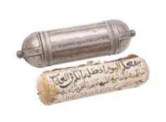 A Persian silver prayer holder: of cylindrical outline with panelled decoration and rounded ends,