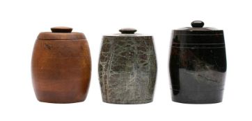 Two turned serpentine barrel shaped tobacco jars and covers: together with a similar banded
