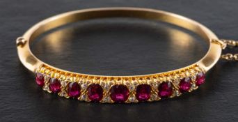 A hinged ruby and single-cut diamond bangle,: estimated total ruby weight ca.