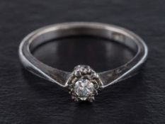 A round, brilliant-cut diamond ring,: estimated diamond weight ca. 0.