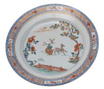 A Chinese verte/imari charger: painted with a deer pulling a cart containing a flowering plant in a