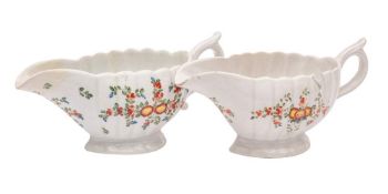 A matched pair of Plymouth polychrome fluted sauceboats: painted with chrysanthemum and other