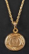 A medallion pendant and cable-link chain,