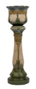 A Burmantofts Art Nouveau faience jardinere and stand: moulded with flowers,