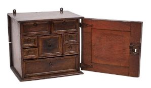 A Jacobean oak spice cabinet, circa 1685 and later elements,
