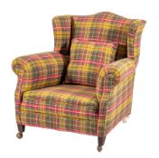 An upholstered wing armchair, early 20th century,