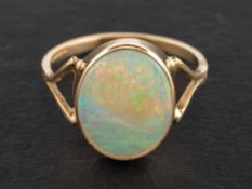 A 9ct gold, cabochon-cut opal ring,: estimated opal weight ca. 3.