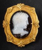A carved sardonyx cameo brooch/ pendant,: depicting a classical gentleman in profile,