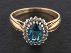 A 9ct gold, blue topaz and single-cut diamond cluster ring,: estimated topaz weight ca. 1.