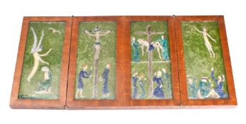 An enamel and glass low relief four-panel icon: depicting The Annunciation, The Crucifixion,