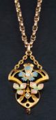An Art Nouveau style seed pearl and enamel openwork pendant of floral design,: stamped '9ct',