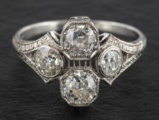 An old-cut diamond cluster ring of quatrefoil design,: estimated total diamond weight ca. 1.