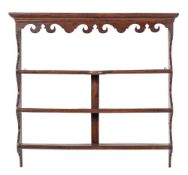 A set of George III oak wall hanging shelves, circa 1760,