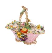 A mixed lot of ceramics: comprising a French faience plate moulded and painted with floral sprays