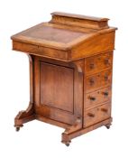 A Victorian walnut Davenport, circa 1870,