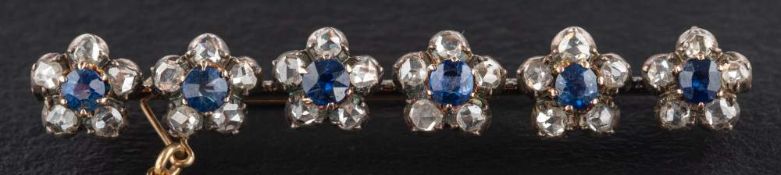 A rose-cut diamond and sapphire bar brooch of flower head design, total estimated diamond weight ca.