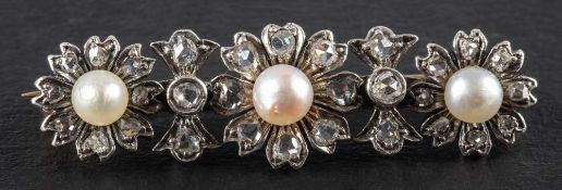 A Victorian, gold and silver rose-cut diamond and pearl brooch,: of triple flowerhead design,