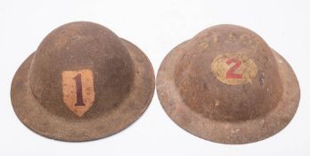 A WWII MK I steel helmet marked 'Stage 2': together with one other with a red '1' on a white
