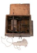 A 19th Century mechanical hoist: contained in a wooden box with cover,