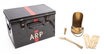 A small group of militaria comprising an ARP tin, two button polishers,