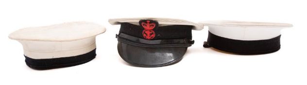 A Royal Navy peaked cap together with two other Royal Navy caps (3)