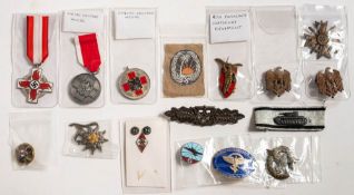 A group of German badges and medals: including an enamel NSDAP lapel badge,