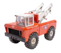 A Tonka ' Mighty' Wrecker white cab and jib over red body and black wheels.