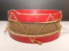 A WWI period scratch built toy drum constructed from a tin, bentwood,