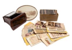 A small collection of various stereoscope cards: including three 'Optical Transpositions' cards,