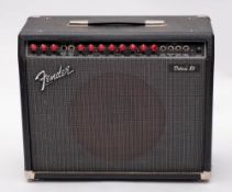 A Fender Deluxe 85 guitar amplifier serial number L097325, with footswitch.