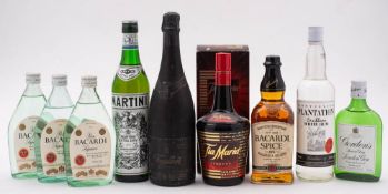 Three half bottles of Barcardi Rum: a bottle of Barcardi Spice and miscellaneous spirits.