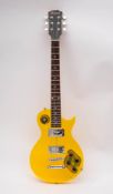 A Wesley yellow plastic Les Paul style electric guitar, plated machine heads, dot fret markers,