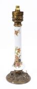 An opaque glass and brass mounted column oil lamp:, the column painted with flowers,
