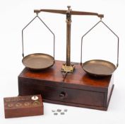 A set of early 20th century American mahogany and brass apothecary scales by Henry Troemner,