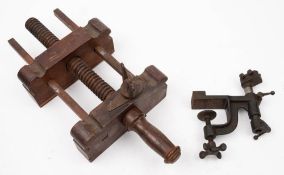 A 19th century wooden clamp or vice with pointed steel blade: together with a lathe rest by F.