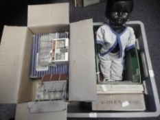 A Pedigree plastic black doll with black hair, weighted brown eyes, open mouth with two upper teeth,