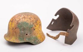 A German M1916 pattern stahlelm: ( poor condition) together with a reproduction German Stalhelm