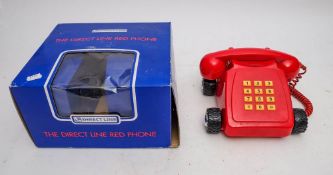 A boxed 'Direct Line' telephone.