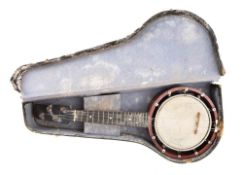 An early 20th century Zither banjo, unsigned, 55cm long.
