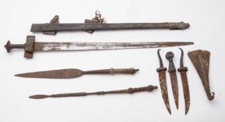 A North African Tuareg sword: the straight double edge blade stamped with opposing crescent moon
