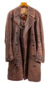 An early 20th century dark brown leather motoring/flying overcoat: no label,