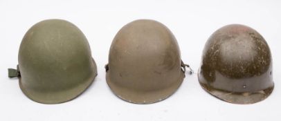 Two M1 style steel helmets and a fibreglass M1 style civil defense helmet (3)