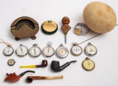 A small collection of miscellaneous collectables, including five various pipes, a pedometer,