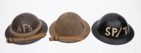 Three WWII MK I steel helmets: one marked 'AFS' with rank band,