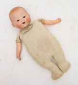 An Armand Marseille bisque head baby doll, moulded hair,